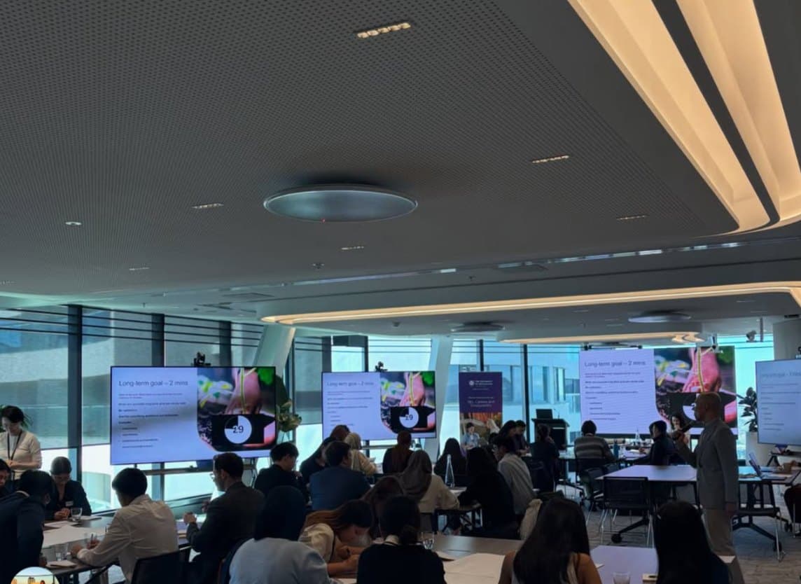 Consultants working on a timed exercise at a partner firm's offices
